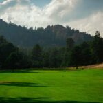 View of hole #5 green and mountain backdrop