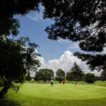 Kennedy Putting Green from Behind the Trees