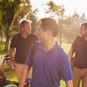 Diverse group of adults golfing